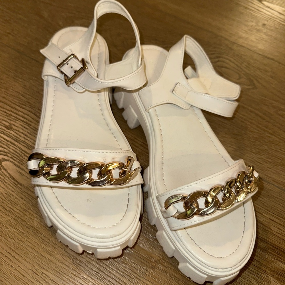 White heels with gold detail